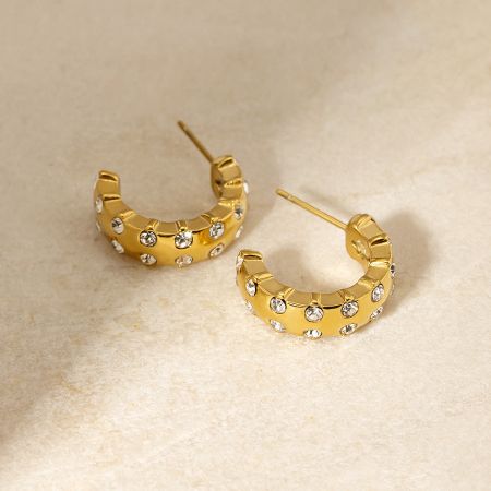 Detailed studio shot of the stainless steel C-shape stud earrings.