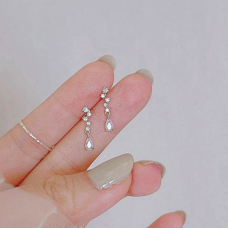 Full pair view of the gold-plated sterling silver teardrop earrings against a white background.