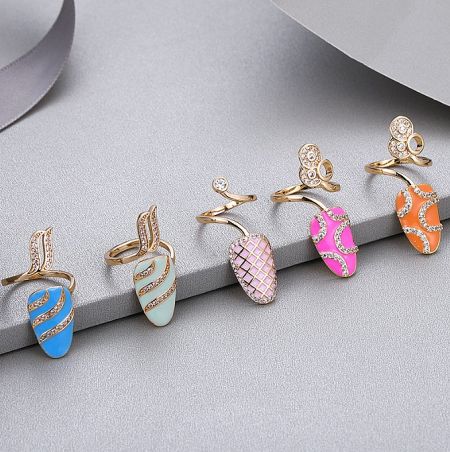 A collection of gold earrings with vibrant enamel designs, representing the style of the Spring/Summer collection.