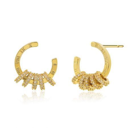 A detailed view of the gold circle hoop studs, highlighting the leaf-like arrangement of cubic zirconia crystals at the base of the hoop.