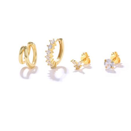 Set of 4 Gold Mini Earrings - A set of four gold mini earrings, style JRE-128, featuring various designs including hoops and studs with sparkling white cubic zirconia.