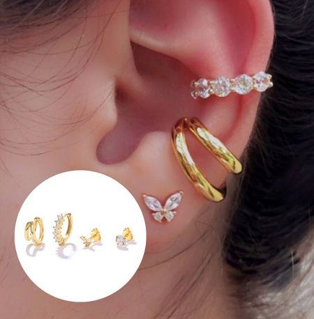 Model showcasing the Set of 4 Gold Mini Earrings, highlighting their versatile styling options on the ear.