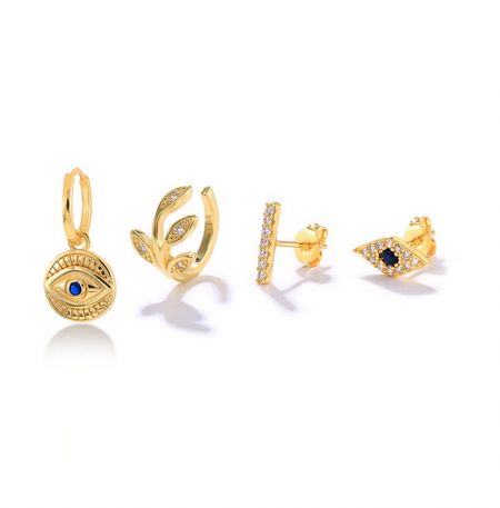 Evil Eyes Hoop Huggie Earrings Set - A set of four Evil Eyes Hoop Huggie Earrings in gold plating, featuring various designs with sparkling cubic zirconia gemstones, displayed on a white background.