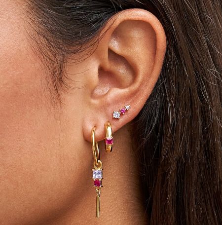 Detailed shot of the gold earring set showcasing the intricate setting of the multi-colored gemstones, perfect for wholesale jewelry collections.