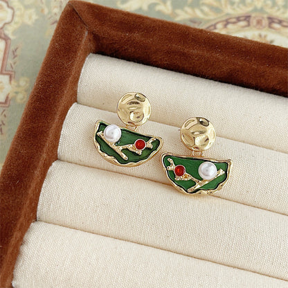 The set of gold-plated enamel earrings displayed in a professional jewelry box, ready for wholesale.