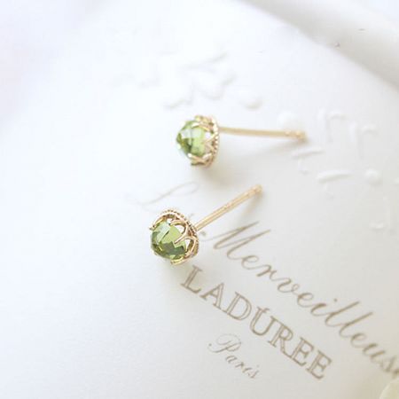 925 Sterling Silver 18K Gold Plated Peridot Stud Earrings (Set of 5 Pairs) - A pair of 925 sterling silver peridot stud earrings with 18K gold plating, elegantly displayed on a white branded box.