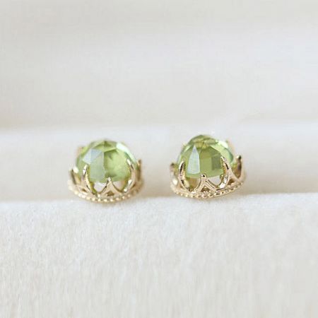 Top-down view of the sparkling 18K gold plated peridot stud earrings.