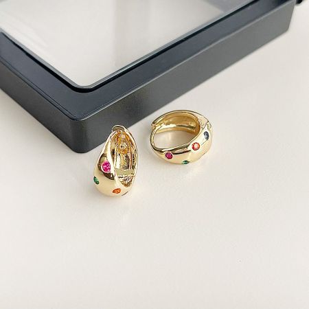 Detailed view of the 14k gold plated hoop earrings highlighting the intricate setting of the colorful zircon stones.