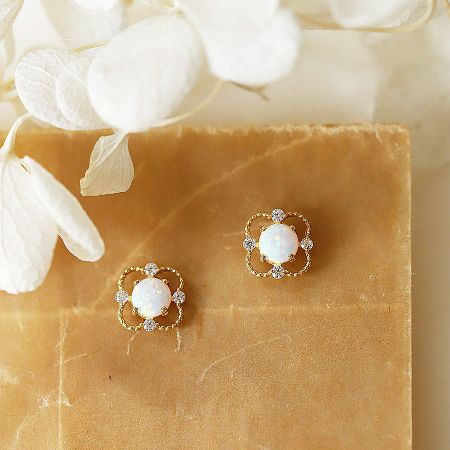 Detailed view of the 925 sterling silver stud earrings showcasing the brilliant opal and zircon stones.