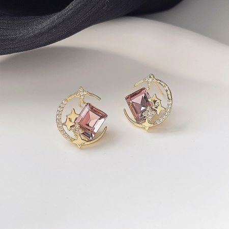 14k Gold Plated Glass Crystal Moon Star Stud Earrings (5 Pairs Set) - A set of five 14k gold-plated moon and star stud earrings with pink glass crystals, displayed on a white surface.