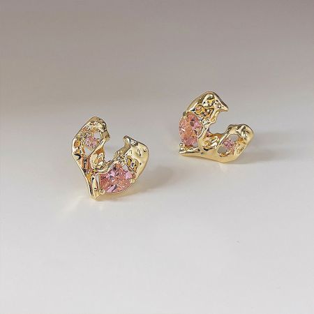 Gold Plated Pink Crystal Irregular Heart Stud Earrings (5 Pairs Set) - A close-up shot of a pair of gold-plated irregular heart stud earrings, each featuring a vibrant pink crystal gemstone.