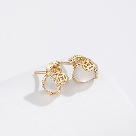 Another angle of the gold-plated stud earrings, highlighting the intricate design.