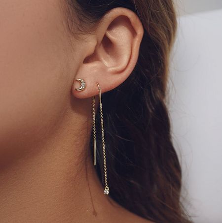 Model showcasing the elegant drape of the 925 sterling silver threader drop wedding earrings.