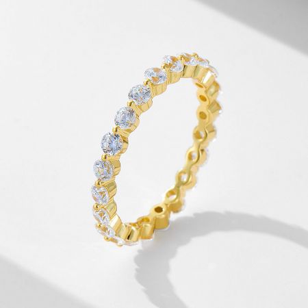 Close-up view of the matching yellow gold plated eternity band, fully adorned with sparkling cubic zirconia stones.