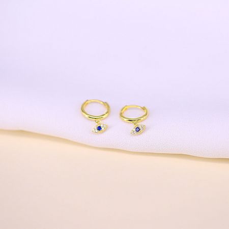The gold-plated version of the evil eye hoop earrings with blue and white gemstones.