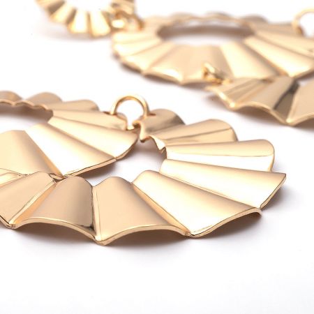 Side profile of the fan-shaped gold-plated brass statement earrings.