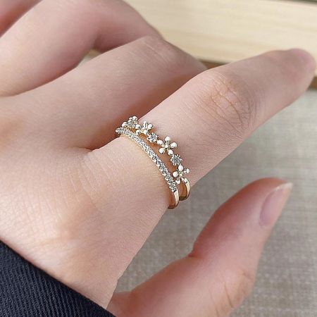 14k Gold Plated White Enamel Daisy Flower with Zircon Ring Set of 5 - A close-up of two 14k gold-plated rings from the daisy flower collection, featuring white enamel petals and zircon centers.