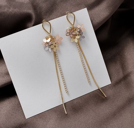 Detailed shot of the Three Tone Flower Long Drop Earrings, highlighting the intricate floral design and crystal details.