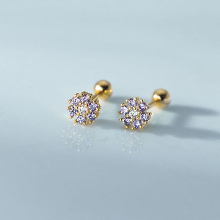 A pair of gold flower stud earrings with elegant purple and clear cubic zirconia gems.