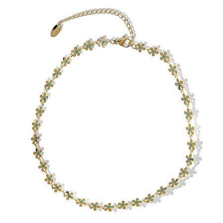 The gold-toned, floral-designed necklace with turquoise and white accents shown in detail.