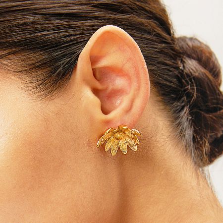 Close-up view of the 3D sunflower stud earring worn on an ear, showcasing its intricate texture.