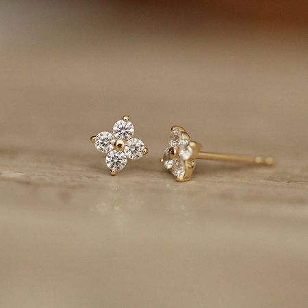 Another angle of the lucky four-leaf clover stud earrings, highlighting their delicate craftsmanship.