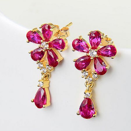 Angled shot of the pink and white gemstone flower earrings, showcasing their sparkle and dimension.