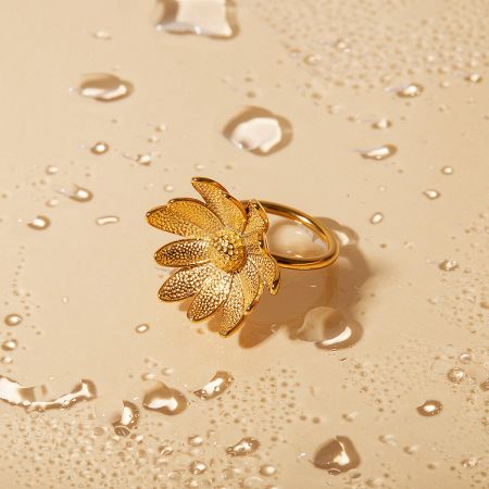 Detailed product shot of the daisy sunflower ring on a neutral background.