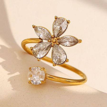 CZ Stone Zirconia Adjustable Open Stainless Steel Flower Ring for Women (Set of 5) - A close-up of an 18K gold-plated stainless steel flower ring with a central clear CZ zirconia stone.