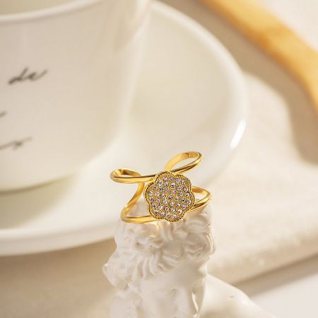 Another view of the flower-shaped diamond-encrusted ring, showcasing its sparkle.