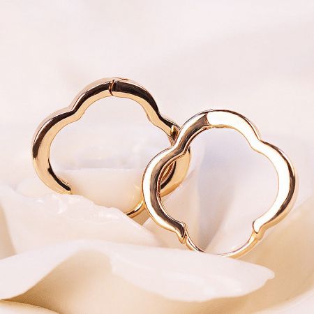 Wholesale 925 Sterling Silver Gold Four Clover Leaf Hoop Earrings (5 Sets) - A detailed studio shot of gold-plated 925 sterling silver hoop earrings designed in a delicate four-leaf clover shape, offered by JR Fashion Accessories.