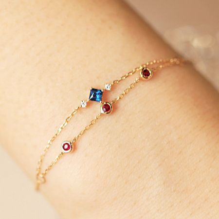 Wholesale 925 Sterling Silver Two-Layered Color Zircon Chain Bracelets (Set of 5) - A close-up of a wholesale 925 sterling silver two-layered chain bracelet with colorful blue, red, and white zircon gemstones.