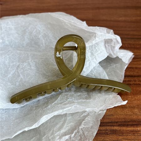 Gold acetate hair jaw clip with French design.