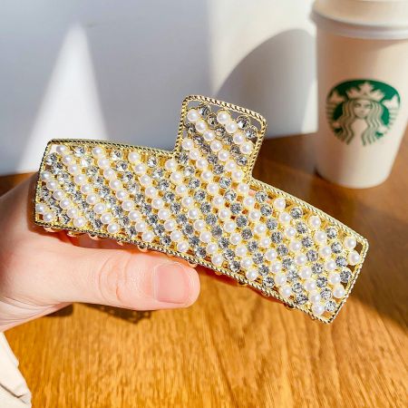 Detailed view of the gold-pearl variant, highlighting the intricate combination of faux pearls and rhinestones.