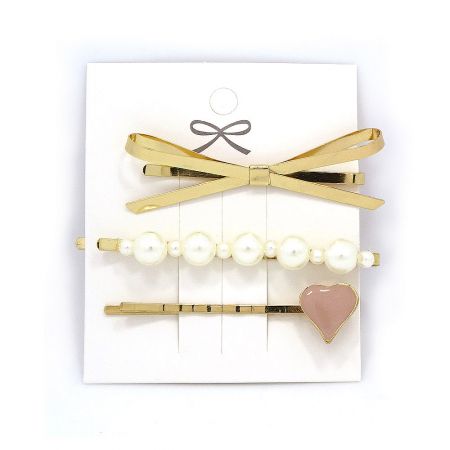 Faux Pearl Metal Heart Hair Clip Set of 3 - A stylish set of 3 faux pearl and metal hair clips by JR Fashion, featuring a gold bow, a pearl-studded clip, and a pink heart design.