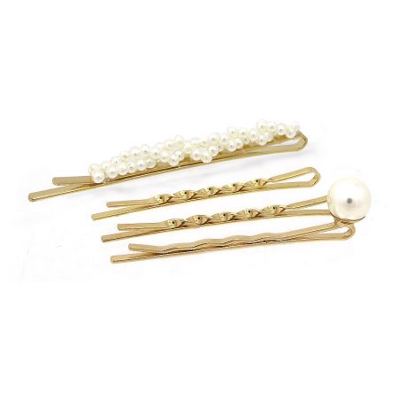 Three distinct styles of gold hair clips with pearl accents, ideal for different hairstyles.