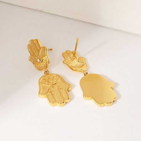 Front and back view of the gold Hamsa hand earrings, highlighting the detailed front and smooth back.