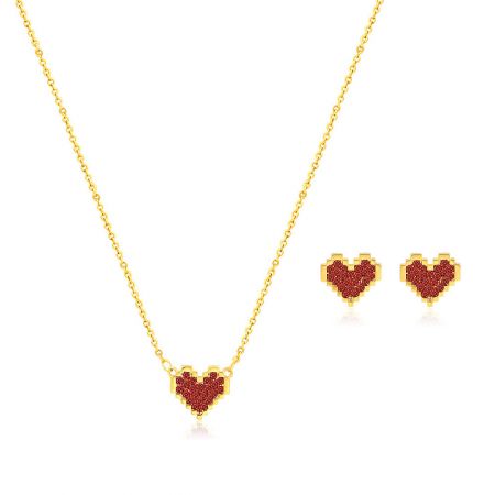 Wholesale gold heart-shaped jewelry set with vibrant red gemstones.