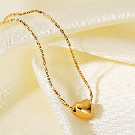 Detailed shot of the stainless steel heart necklace's clasp and finish.