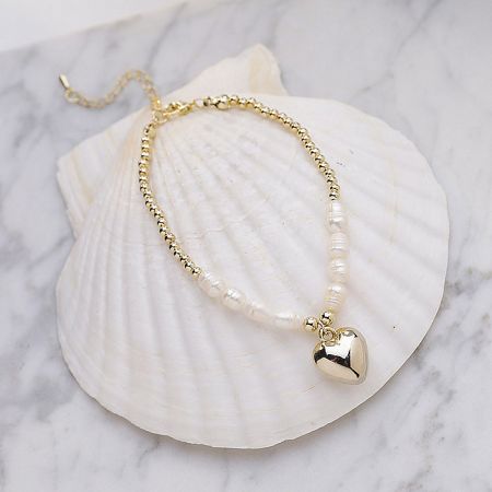 Detailed view of the Valentine Heart Pendant Pearl Bracelet on a white background.