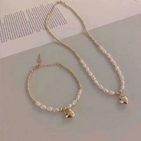 The complete Valentine jewelry set, including the heart pendant necklace and matching bracelet.