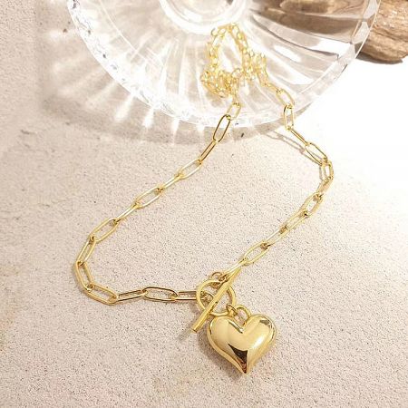 Gold necklace with a polished puff heart-shaped pendant.