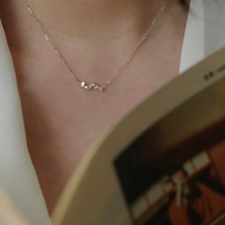 925 Sterling Silver Irregular Heart Zircon Necklace Set of 5 - A close-up of the 925 Sterling Silver Irregular Heart Zircon Necklace in a gold finish, showcasing the delicate heart-shaped pendant with sparkling zirconia stones.