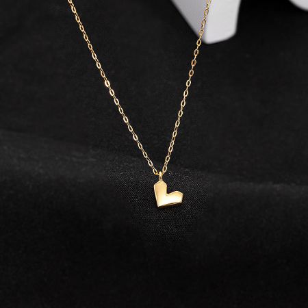 Close-up of the gold-plated heart pendant necklace.