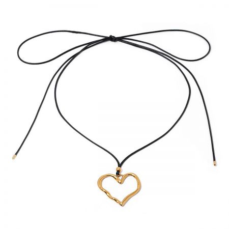 Gold heart pendant with its adjustable black cord necklace.