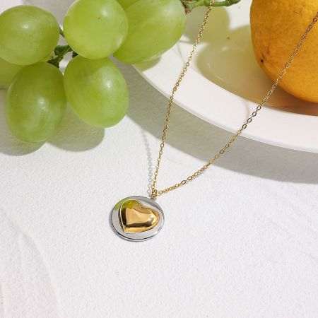 Model wearing the stainless steel heart pendant necklace, demonstrating its collarbone chain length.