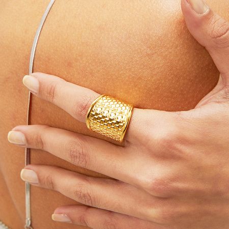 Stainless Steel Gold Snakeskin Fish Skin Textured Wide Rings Set of 5 - A woman's hand wearing a wide, gold-plated stainless steel ring with an intricate snakeskin texture, part of a five-piece set.