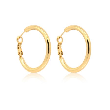 Detailed view of the gold medium hug around hoop earrings latch closure.
