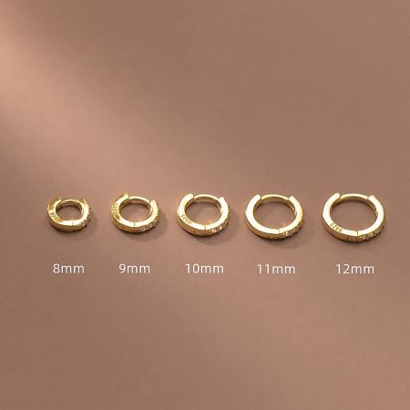 Size comparison of gold zircon huggie hoop earrings, ranging from 8mm to 12mm.