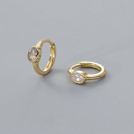 Elegant gold-plated huggie hoop earrings with brilliant clear oval gemstones.